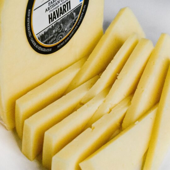 Sliced Hawaiian cheese with a rich yellow color.